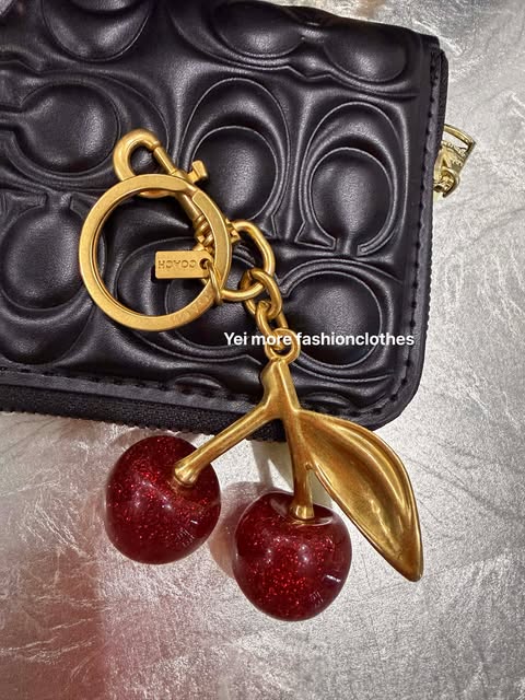 COACH cherry bag charm