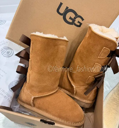 Beautiful UGG-style boots for girls, featuring multiple satin bows and a soft, cozy lining. Perfect for adding a cute and stylish touch to any outfit.