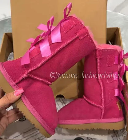 Beautiful UGG-style boots for kids featuring multiple satin bows and a soft, cozy lining. Perfect for adding a cute and stylish touch to any outfit.
