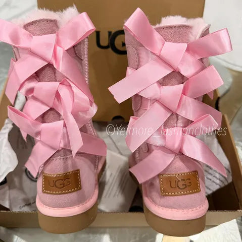 Beautiful UGG-style boots for kids featuring multiple satin bows and a soft, cozy lining. Perfect for adding a cute and stylish touch to any outfit.