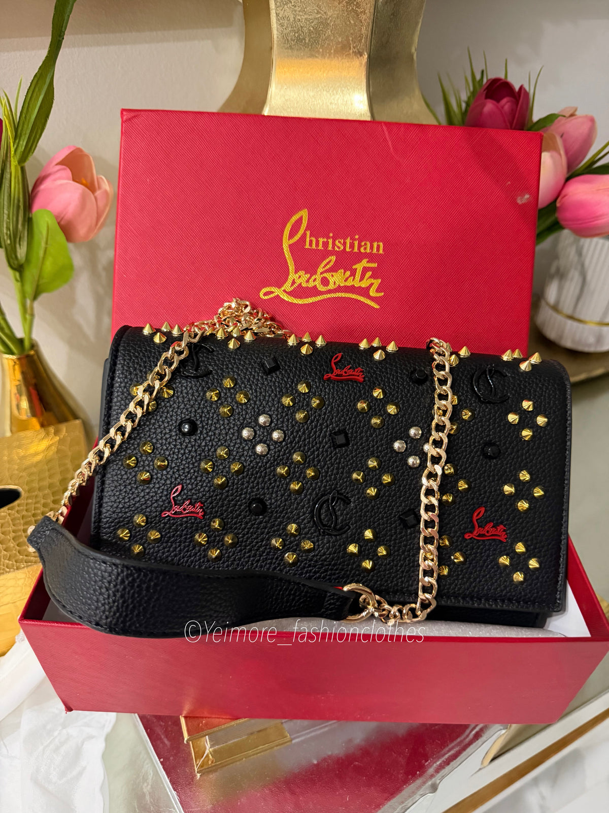 Black handbag with gold details Includes detachable gold chain strap ( Includes box)