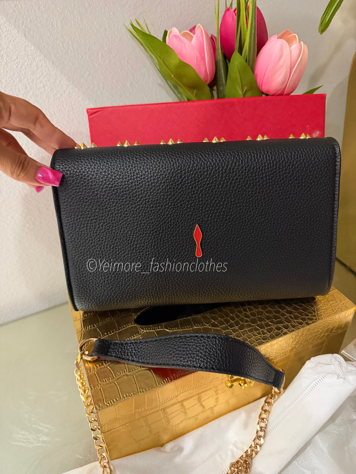 Black handbag with gold details Includes detachable gold chain strap ( Includes box)